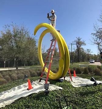 Conservation of artist John Clement's sculpture "Firefly" located in The Woodlands, TX.