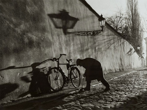 Untitled (Man Repairing Bicycle Tire), 2000