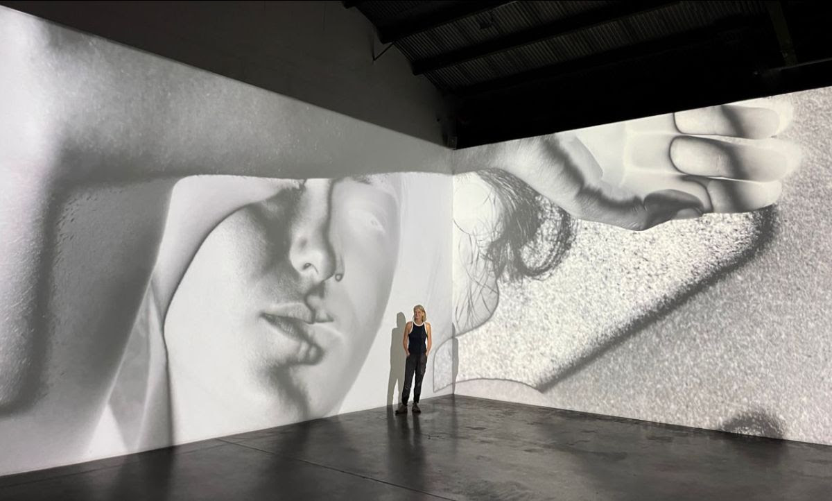 Mona_Kuhn_ in_ front_of_her_installation_at_Galerie_XII_in_Los_Angeles